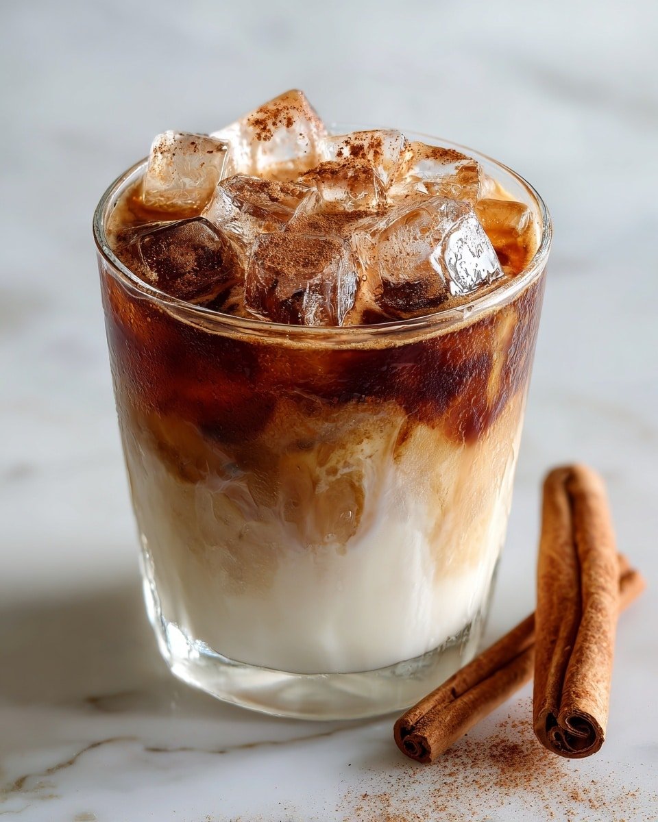 Cookie Butter Iced Chai Latte Recipe - Recipe Image — Cookie Butter Iced Chai Latte, iced chai latte with cookie butter, spiced chai latte recipe, easy iced chai drink, cozy chai latte with cookie butter